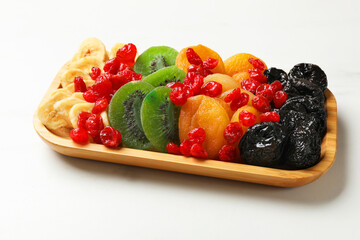Different dried fruits on white table, closeup