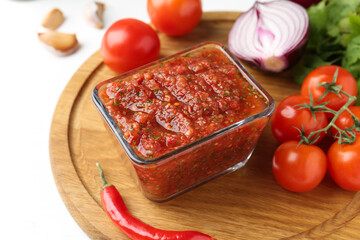 Delicious salsa sauce and ingredients on white table, closeup