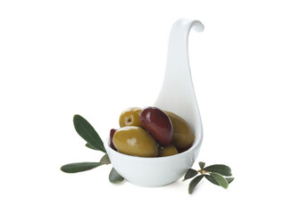 Delicious marinated olives in bowl and leaves isolated on white