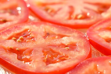 slices of red juicy tomato background