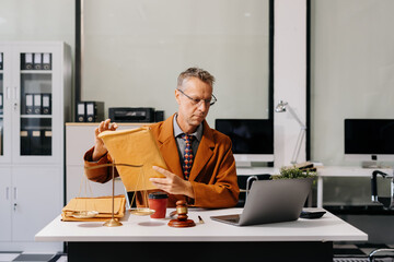 Lawyer business man working with paperwork on his desk in office workplace for consultant lawyer in...