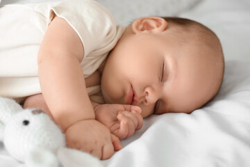 Cute little baby sleeping on bed, closeup