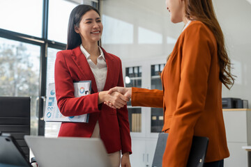 Obraz premium Asian business team happy successful partnership, handshake, success concept.