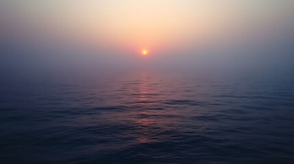 Naklejka premium A foggy morning with the sun just barely visible.