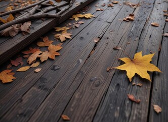 Close-up of dark wood planks with a few fallen leaves and twigs scattered on them,  natural elements , dark wood,  leaf litter