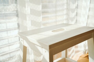 Minimalist White Wooden Stool in Soft Morning Light