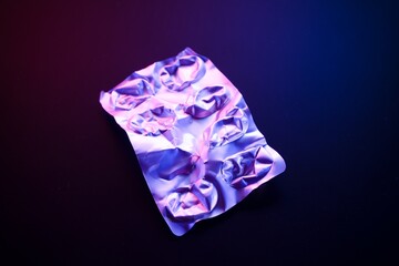 Empty Blister Pack under Neon Lights on Dark Background