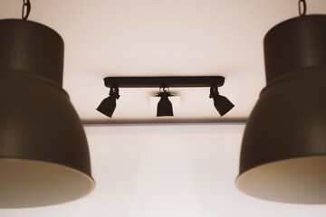 Ceiling Spotlights with Industrial Hanging Lamps in Soft Lighting