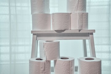 Stacked Toilet Paper Rolls on Stool