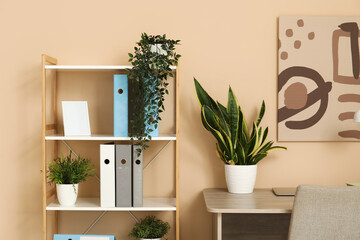 Shelf unit with folders and plants in office