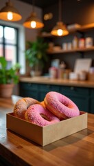 A small box of donuts on a countertop in a bakery or cafe , food, bakery, pastry