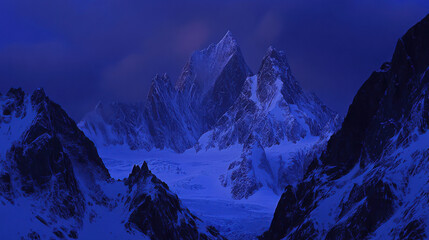 A dramatic mountain ridge bathed in the last light of the day, with intricate rock formations and glacial ice reflecting the ambient glow