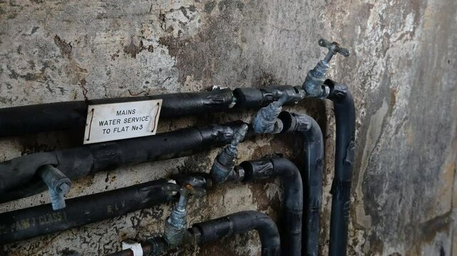 1st March, 2025. London, UK. Mains cold water pipe label and taps. Concept for price rise, water bills, water meter and service. Static shot, 4k.