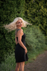 Portrait of a young beautiful blonde girl in nature.