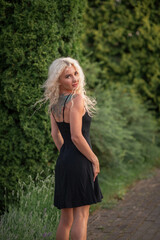 Portrait of a young beautiful blonde girl in nature.