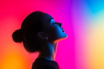 Profile Portrait of a Woman Against Vibrant Colorful Background in Artistic Lighting