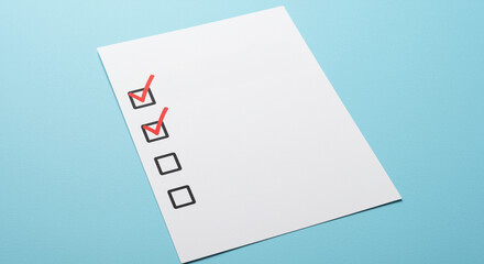 Checklist with red checkmarks on white paper over blue background