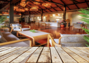 Wooden table top on blur restaurant or cafe background.For montage product display or design key visual layout.View of copy space.