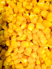 Yellow canned corn close-up. Vertical photo.