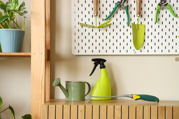 Gardening tools on commode in workshop