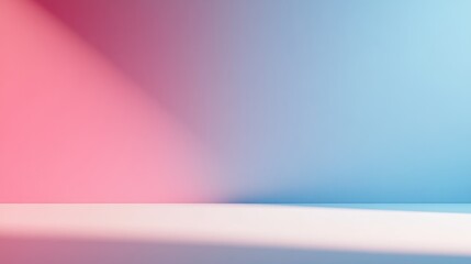 A minimalist studio setup featuring a seamless backdrop transitioning from pink to blue gradient colors