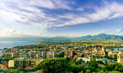 summer travel view from a hill to  beautiful sea coast historical town with port, amazing ocean bay and gulf and beautiful mountains with scenic sunset on background.  sunset of sunrise landscape