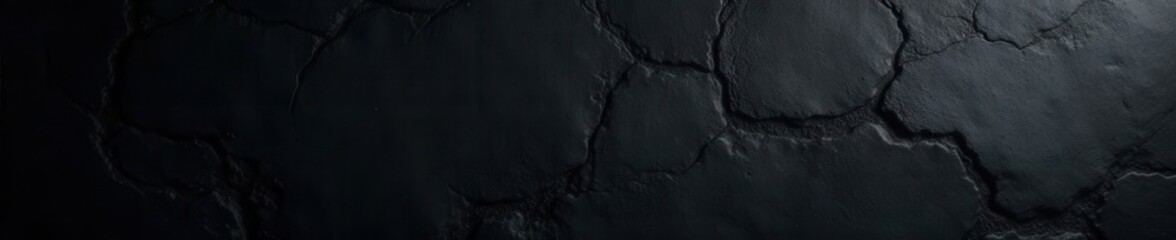 Fototapeta premium Deep black, heavily textured wall; coarse grain, shadowed crevices , distressed, background