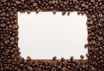 Directly above is the white paper on the table surrounded by roasted coffee beans