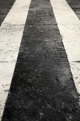 Concrete Floor with Symmetric Black and White Stripes in Gray Tones