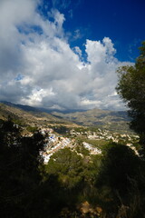 The sea and mountains are landscaped with clouds and sunny weather. Mirador de Cerro gordo
