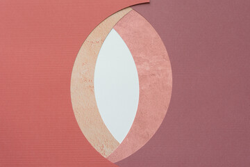 almond shape or swirl like pattern composed of machine-cut paper with curve edge
