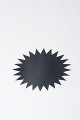 isolated black paper starburst on blank paper