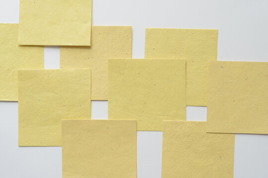 layered pale yellow blank note cards on plain paper