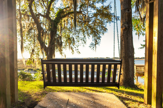 Bench swing at sunset overlooking river