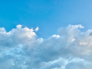 A serene cloud sky background with soft, fluffy clouds drifting across a bright blue sky, creating a peaceful and tranquil atmosphere perfect for any serene scene wallpaper, blue sky with clouds