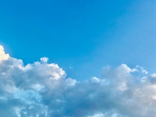 A serene cloud sky background with soft, fluffy clouds drifting across a bright blue sky, creating a peaceful and tranquil atmosphere perfect for any serene scene wallpaper, blue sky with clouds