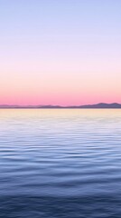 Fototapeta premium Tranquil Waters Reflect Pastel Skies at Dusk Over a Serene Lake Surrounded by Mountains