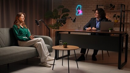 Engaging Discussion Between Podcast Host and Guest in a Modern Recording Studio