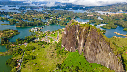 Aerial View of El Peñol Rock in Guatape, Colombia, Surrounded by Lush Green Landscape and Lakes