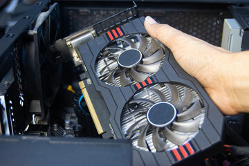 Technicians are assembling graphics cards, computer components.