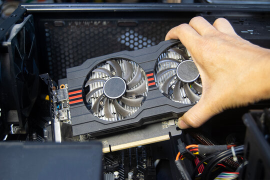 Technicians are assembling graphics cards, computer components.