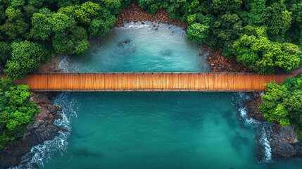 Aerial view of wooden bridge over turquoise coastal waters, lush rainforest backdrop