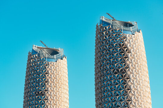 20 January 2025, Abu Dhabi, UAE: Two modern Al Bahar skyscrapers with geometric patterns on their facade inspired by traditional Arabic mashrabiya