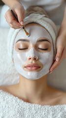 Fototapeta premium Woman getting white facial mask applied spa with eyes closed serene and pampering face treatment