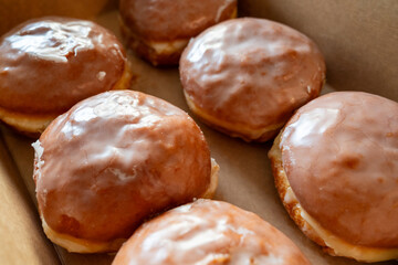 Polish doughnuts with sugar icing- traditional dish eaten in Poland on fat thursday