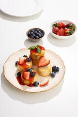 cheesecakes with berries on plate breakfast dish light table