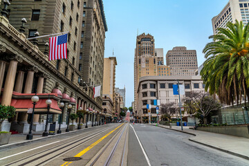 A view up Powell Street along the side of Union Square in the morning in San Francisco in early springtime