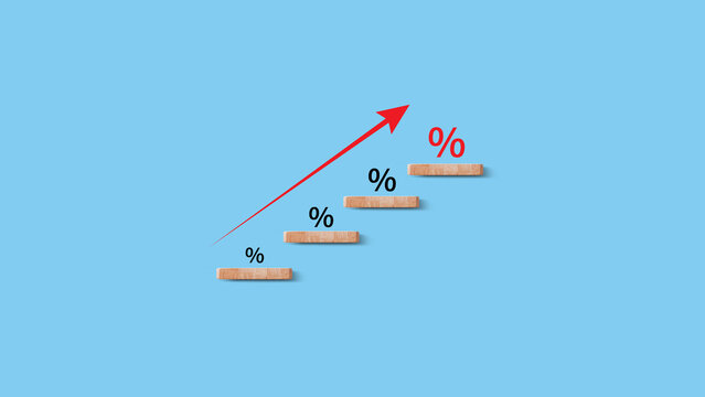 Financial, stocks, interest rate and GDP percent change, wooden block with percentage sign and arrow up sign for interest rate, ranking
