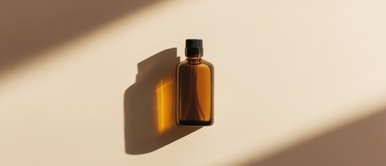 Brown Glass Bottle with Black Cap on Soft Beige Background