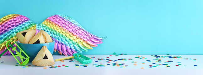 Obraz premium Purim celebration concept (jewish carnival holiday). Hamantaschen cookies over wooden table